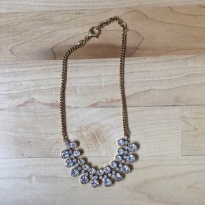 Gold tone and white crystal necklace